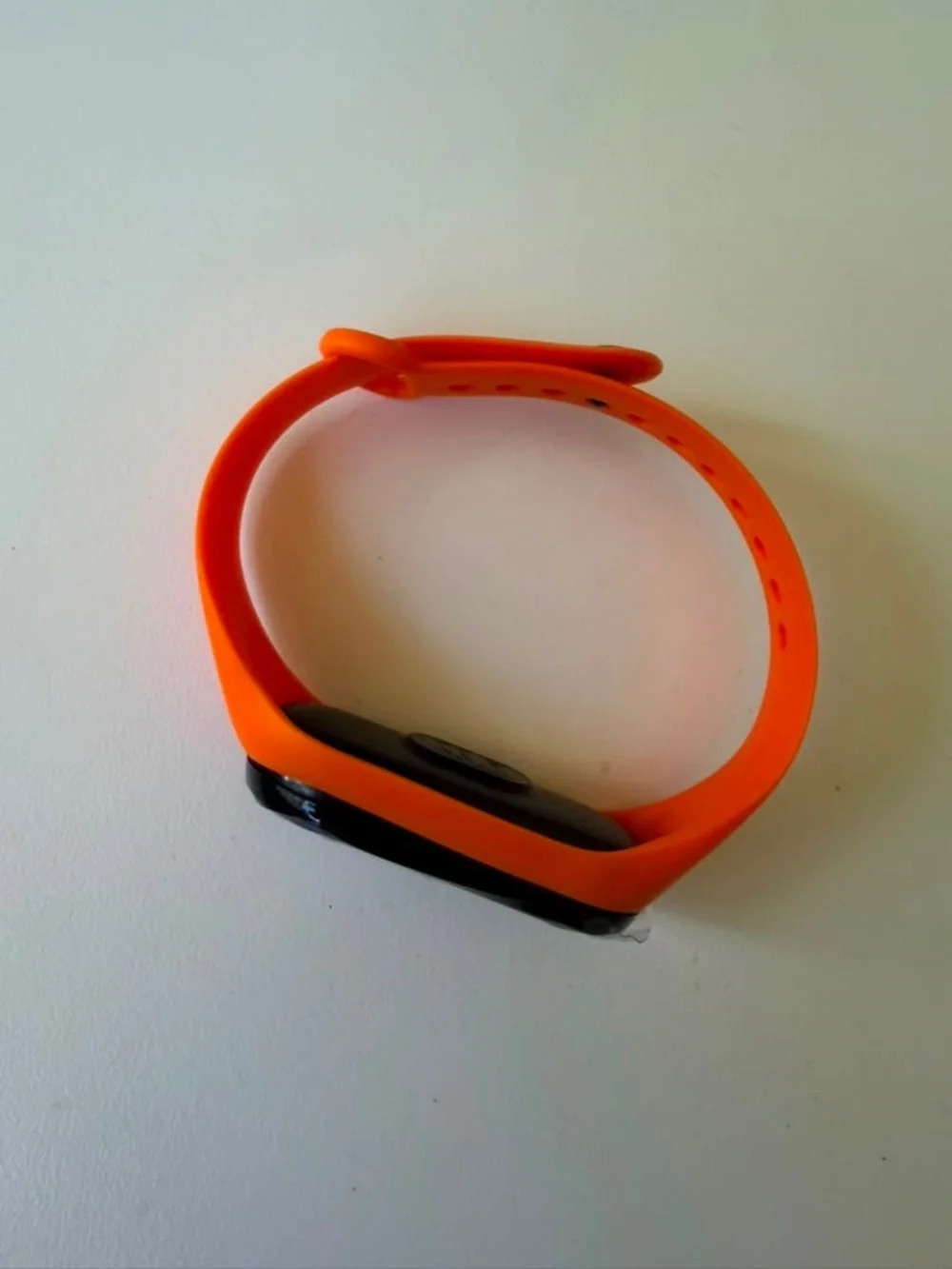 Replaceable Orange Silicone Smartwatch Band with Black Tracker Module